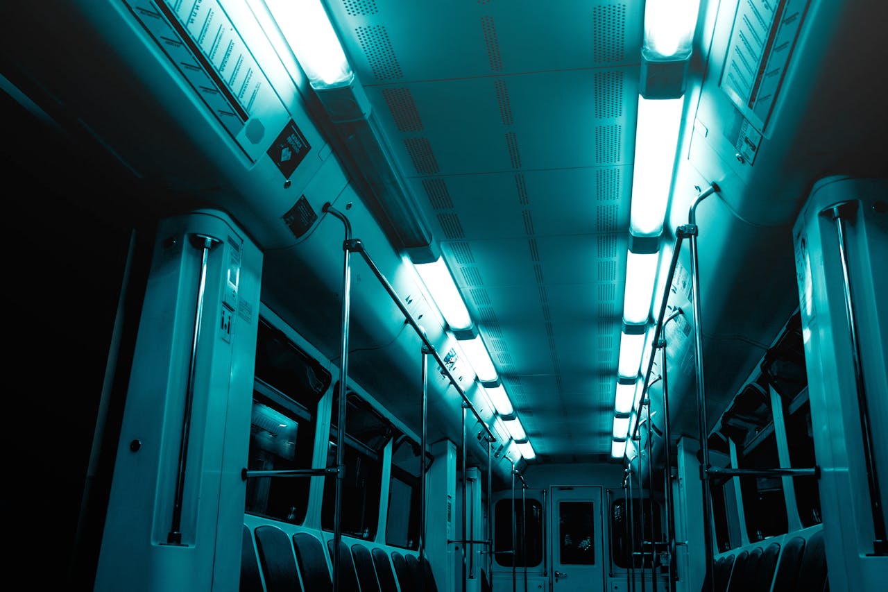 Explore the moody lighting and modern design of an empty subway train.